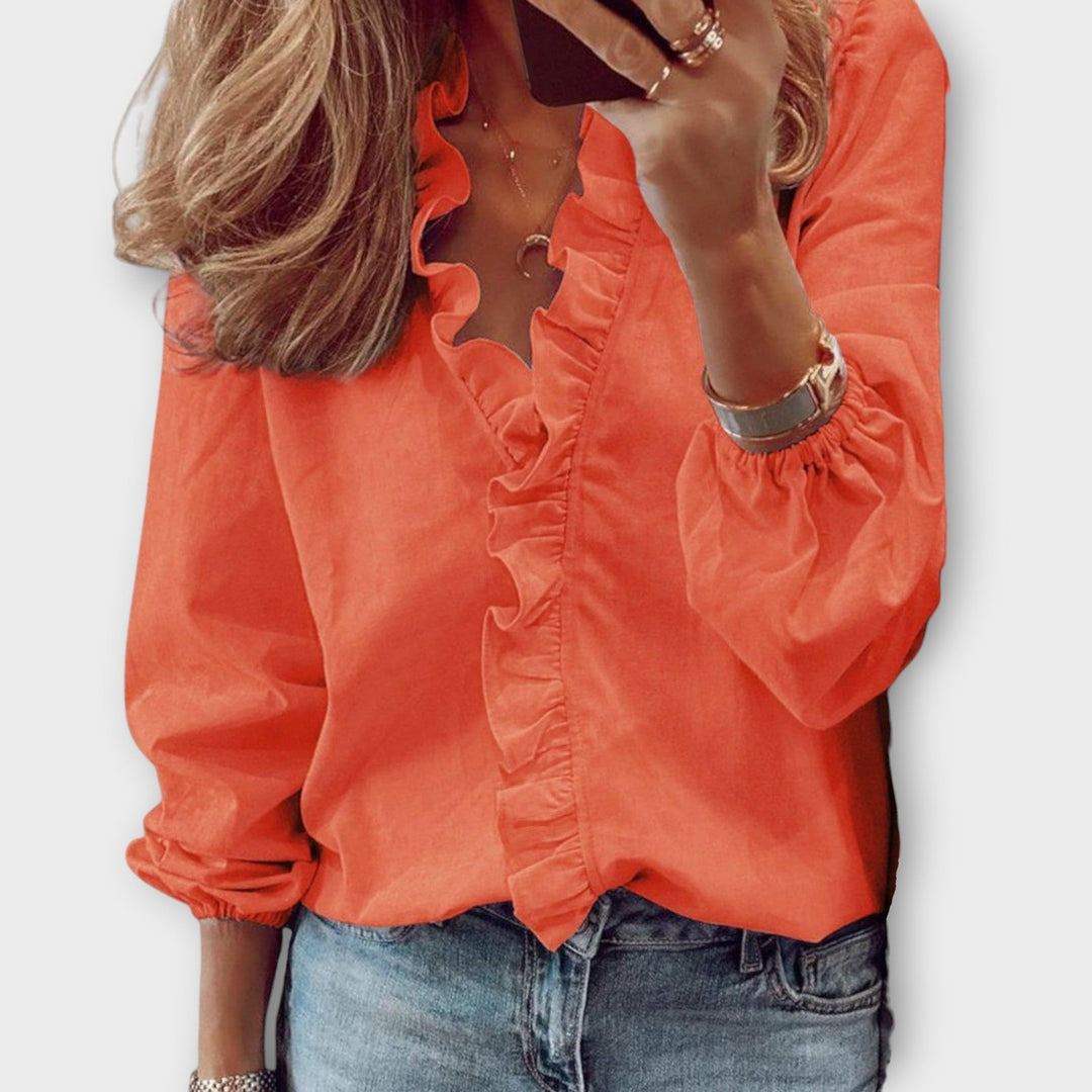 Chic women's ruffled summer blouse, an elegant shirt suitable for office attire or smart casual occasions.