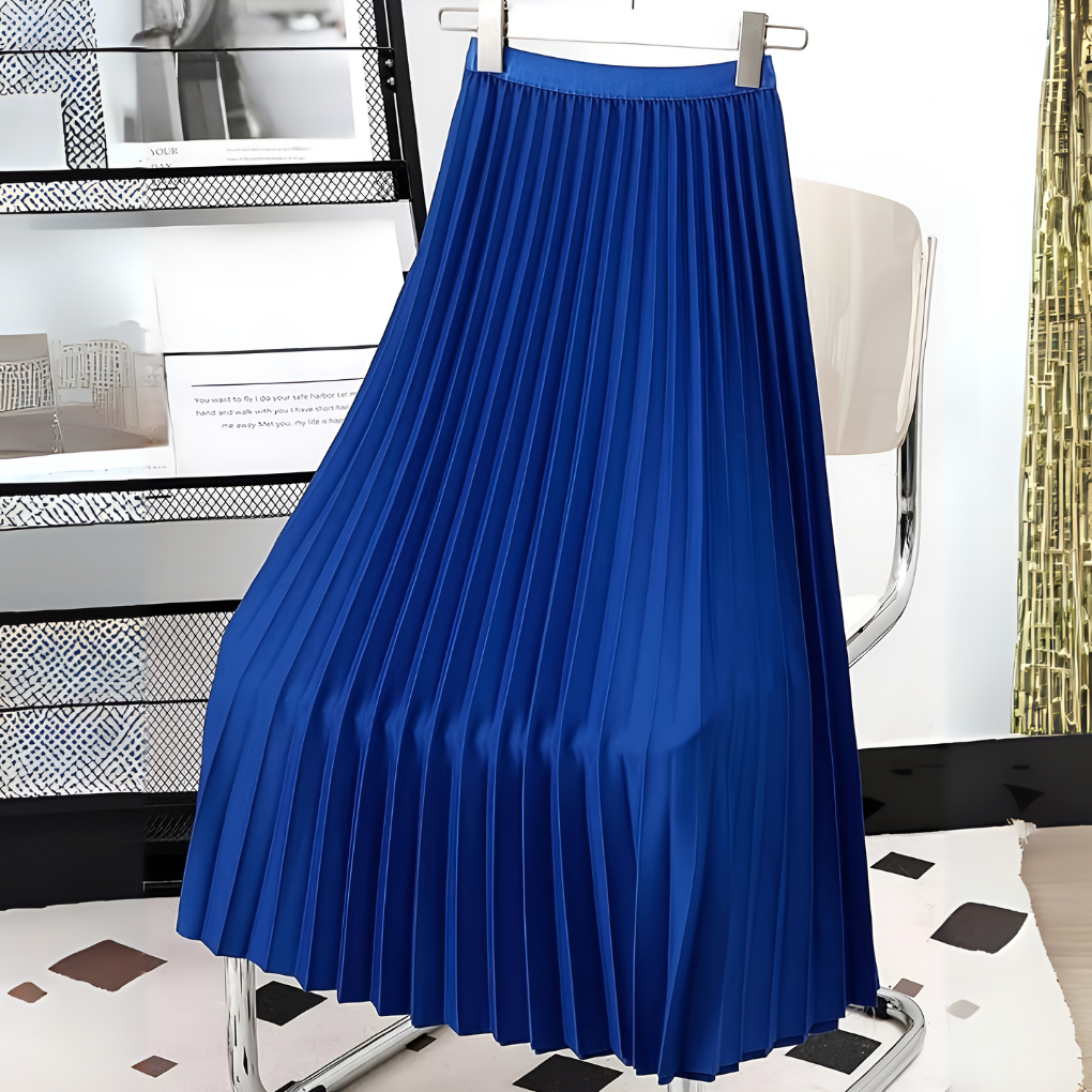 Woman modeling an elegant satin pleated high-waist midi skirt, showcasing its flowy silhouette and style.