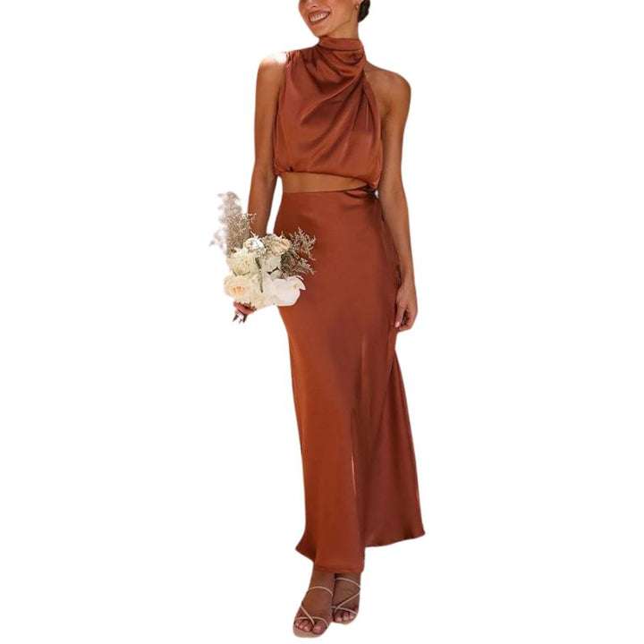 Elegant women's satin two-piece skirt set with halter neck top & midi skirt, perfect for summer parties & events.