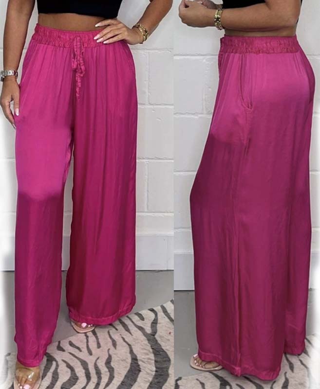 Sophisticated women's satin wide-leg trousers with front lace-up, a versatile autumn apparel choice