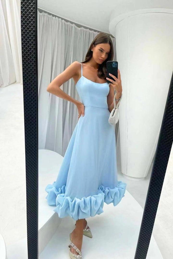 Fashionable women's scoop-neck maxi dress, a perfect long wedding guest outfit with spaghetti straps & ruffle hem.