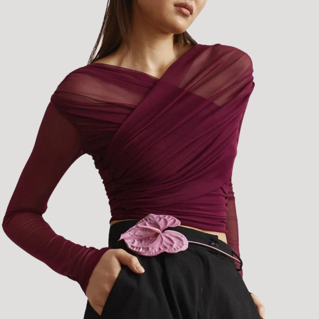 Stylish women's sheer wrap top with long sleeves, offering an elegant and lightweight option for spring.