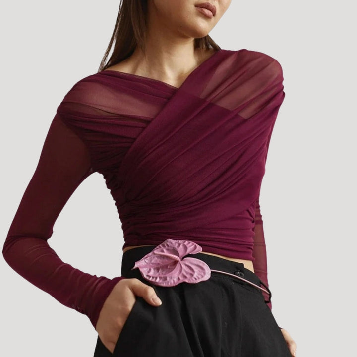 Stylish women's sheer wrap top with long sleeves, offering an elegant and lightweight option for spring.