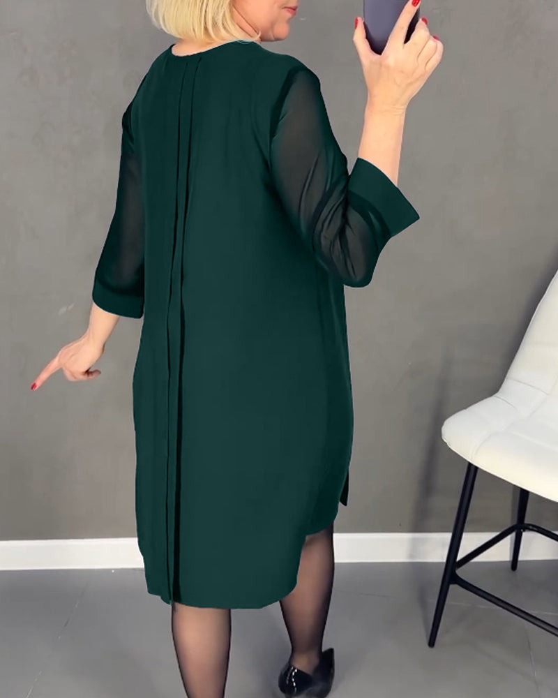 Modern women's elegant shift dress, knee-length, featuring stylish mesh and long sleeves.