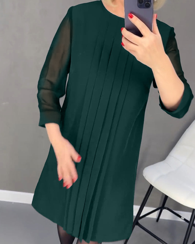 Sophisticated Gabrielle women's dress, shift style, with elegant mesh details and long sleeves.