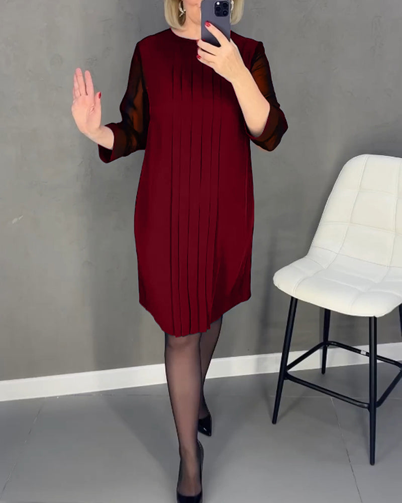 Elegant women's office shift dress, knee-length, with stylish mesh inserts and long sleeves.