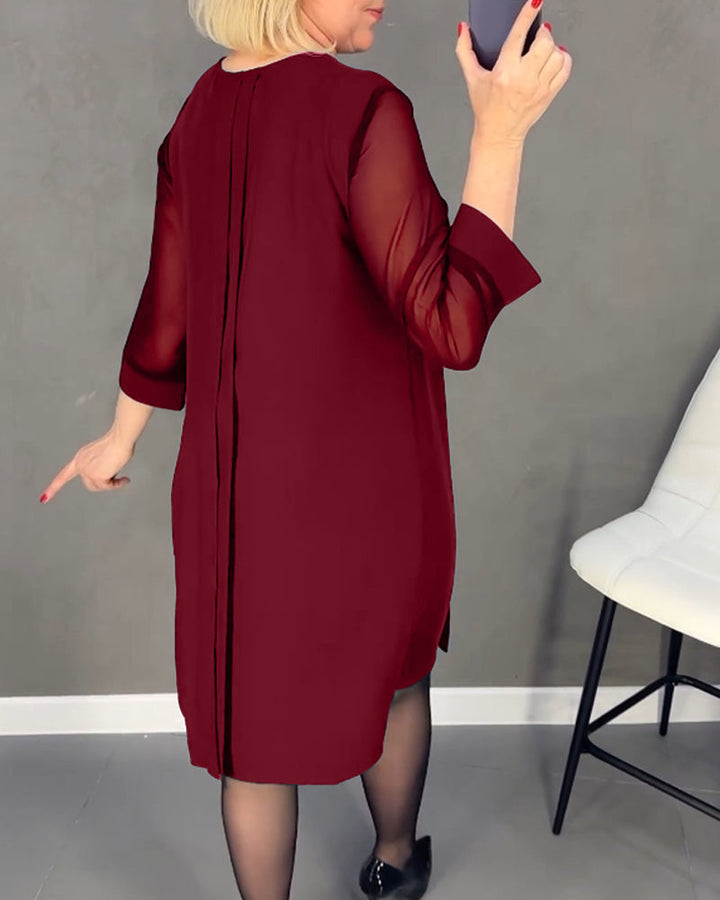 Women's versatile elegant shift dress, long sleeve, knee-length, with unique mesh details.