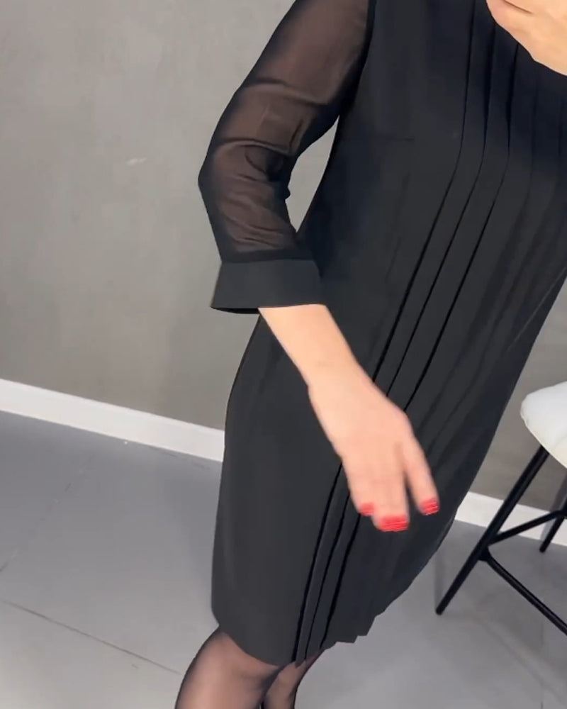 Chic women's mesh-detail shift dress, knee-length, long sleeve, ideal for elegant office or casual wear.