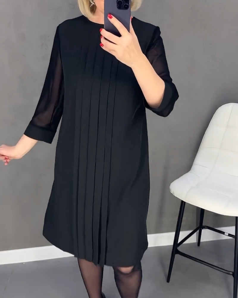 Long sleeve women's shift dress, knee-length, with sophisticated mesh elements for a modern look.