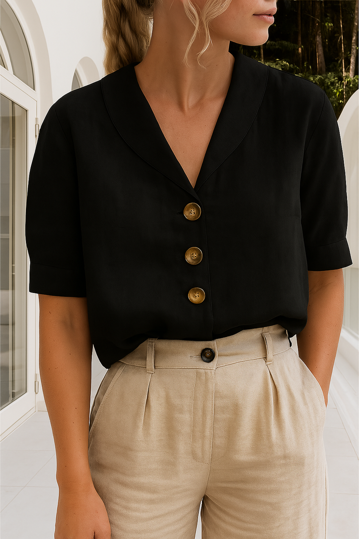 Classic women's short sleeve button-up blouse featuring a flattering V-neck, great for comfortable, elegant everyday wear.