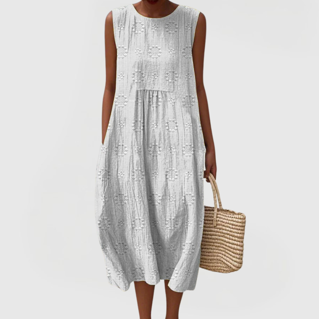 Comfortable sleeveless women's summer dress with practical pockets & tummy control for casual elegance.