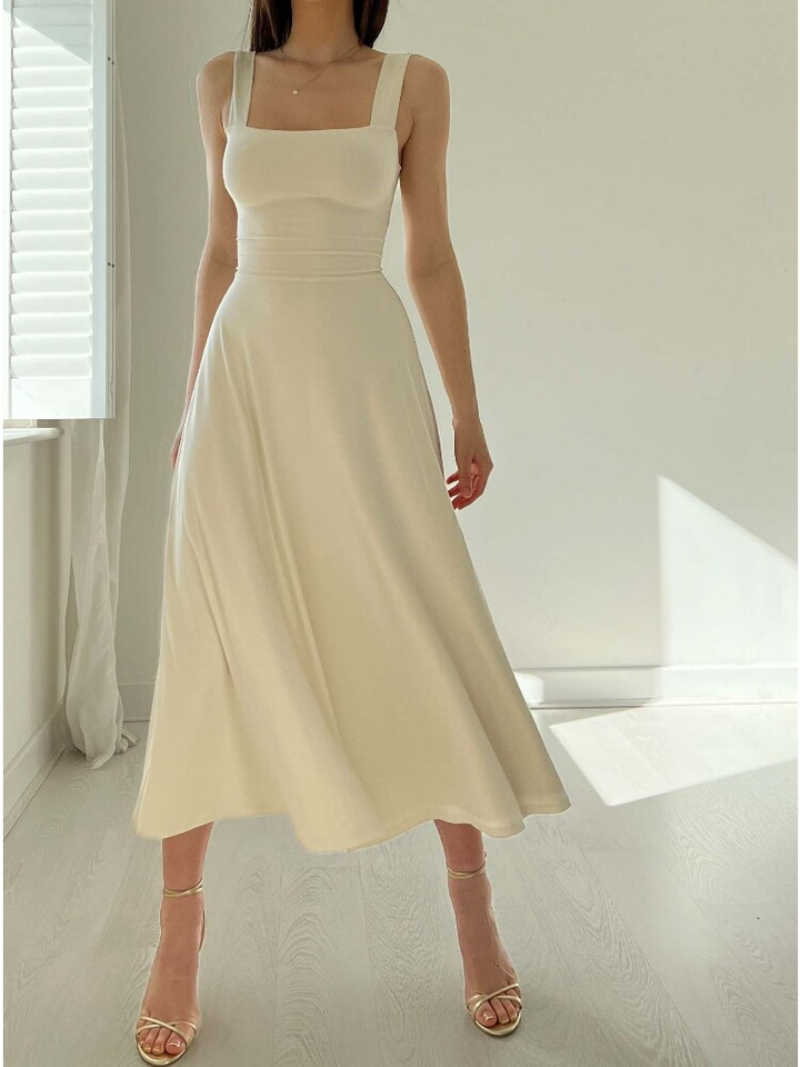 Versatile women's sleeveless A-line midi dress. Effortless style for summer, casual wear, or elegant evenings.