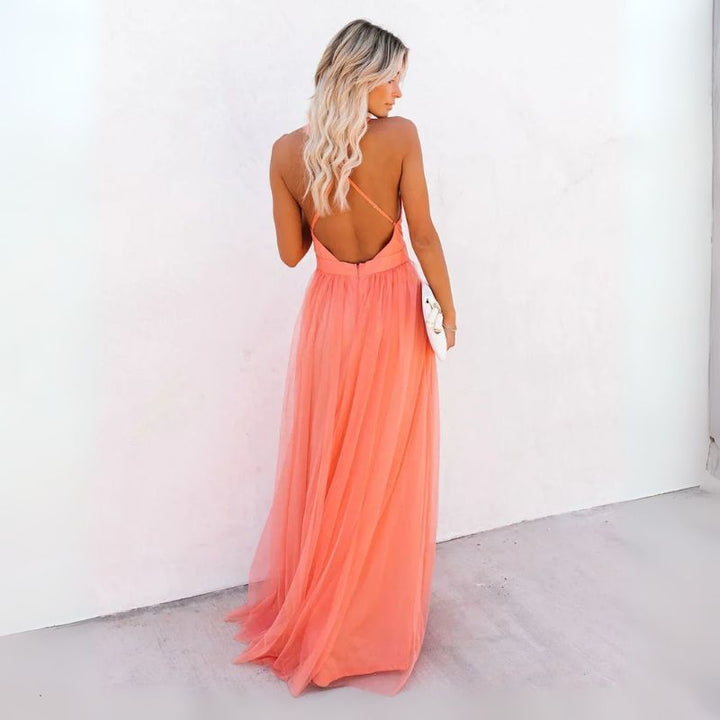 Sophisticated women's sleeveless V-neck maxi evening gown. Elegant formal dress for wedding guests & parties.