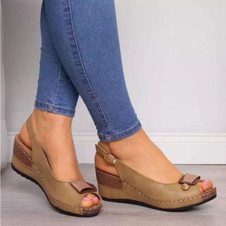 Pair of women's wedge sandals with slingback straps, emphasizing comfortable design