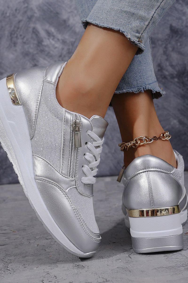 Silver elegant women's slip-on shoes. Comfortable flats for formal, casual, or work. Polished everyday footwear.