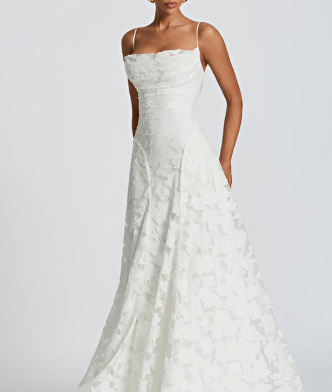 Chic white spaghetti strap A-line maxi dress with open back, great for summer or formal events.