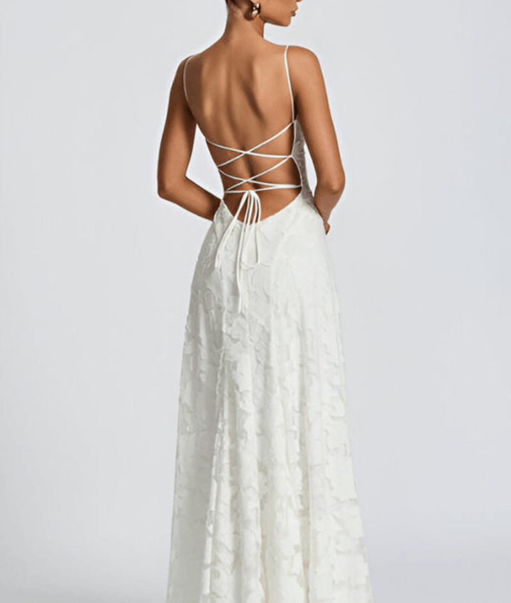 Flowy women's A-line maxi dress with spaghetti straps & open back, an elegant party choice.
