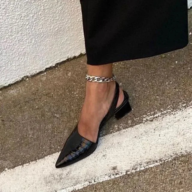 Elegant women's spring pumps with a moderate block heel, designed for both style and lasting comfort.