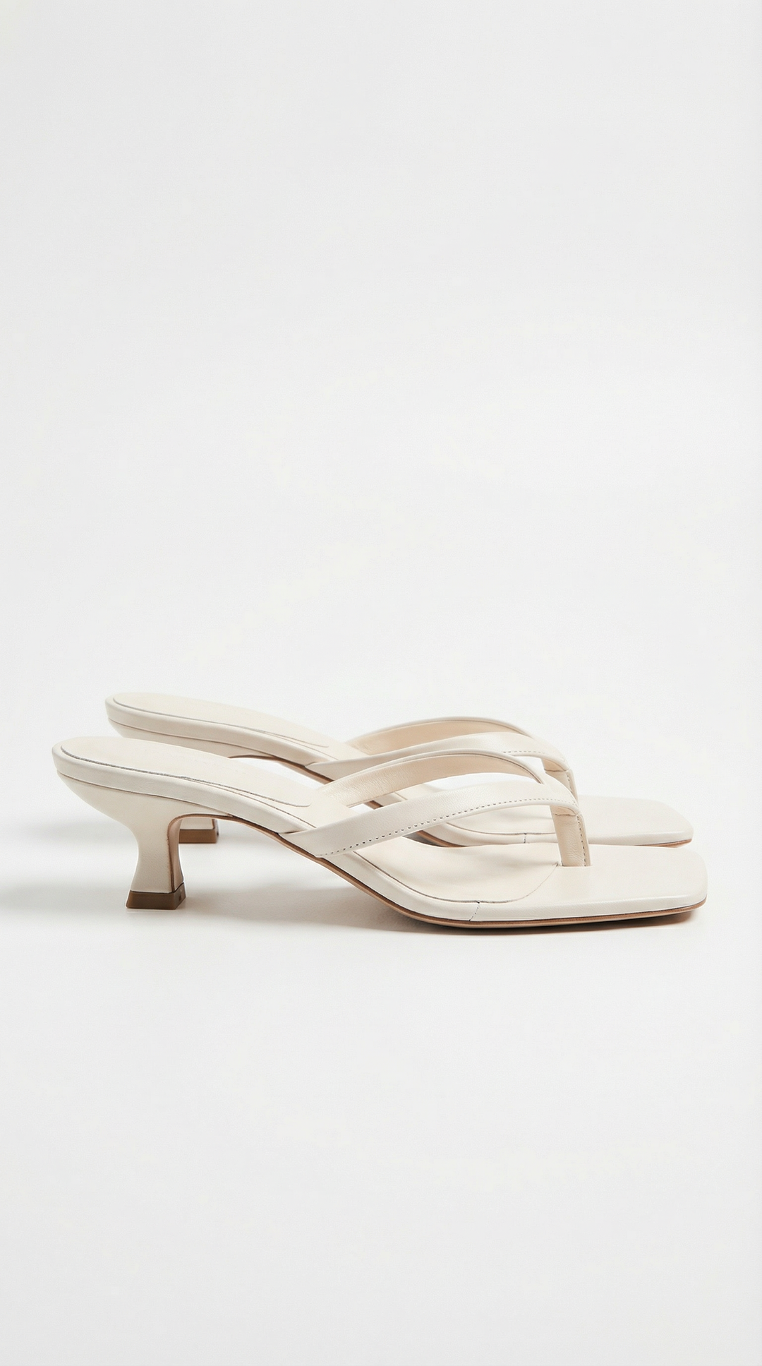 Comfortable and stylish women's kitten heel sandals, with a square toe and thong strap design.