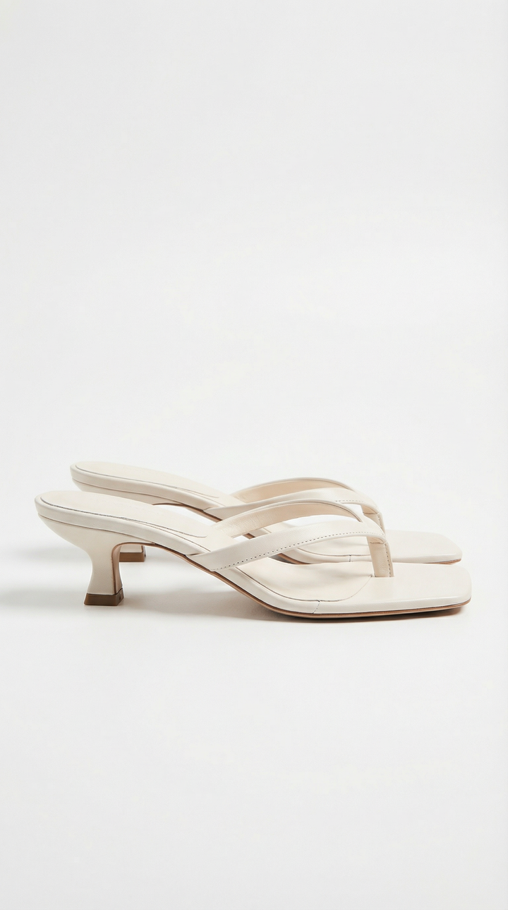 Comfortable and stylish women's kitten heel sandals, with a square toe and thong strap design.
