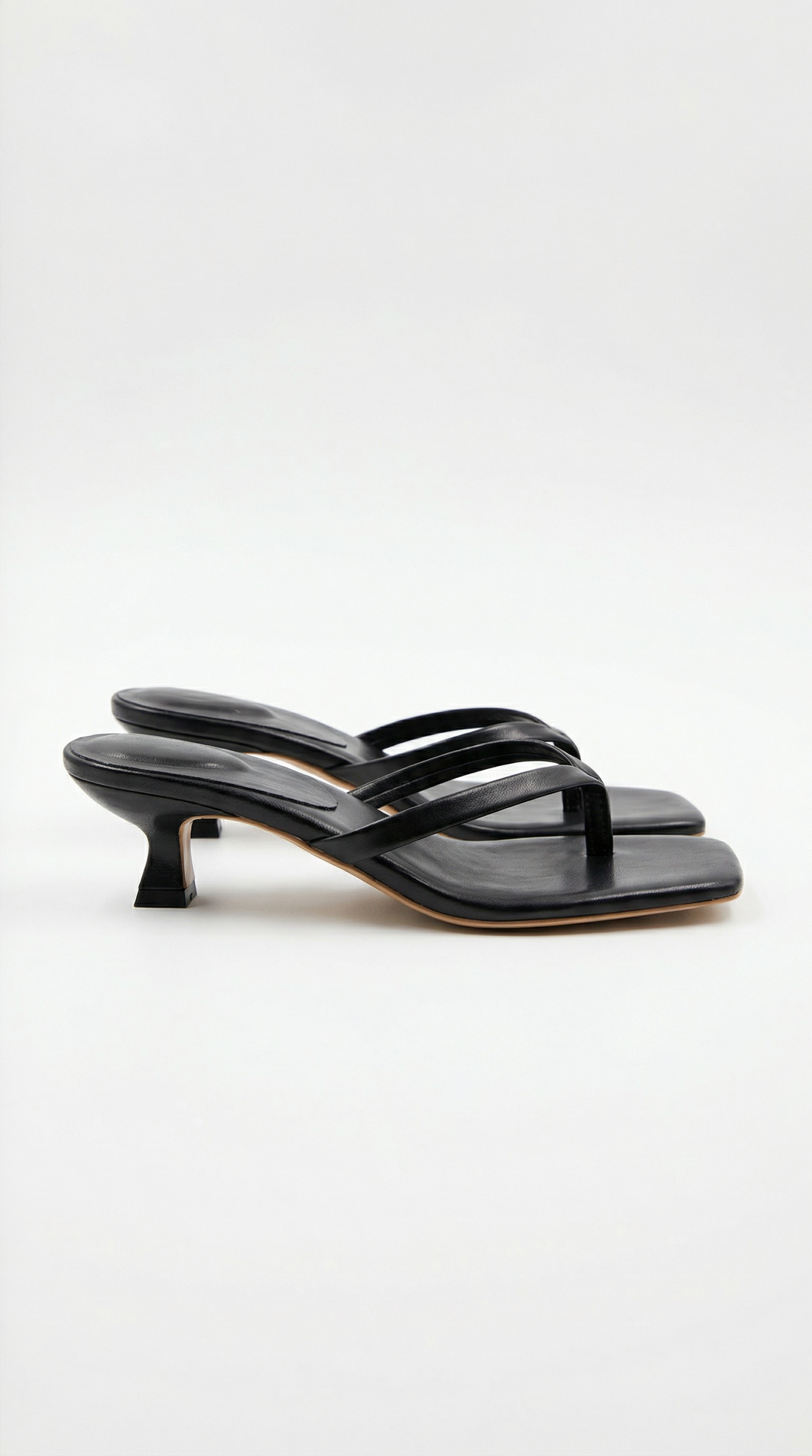 Modern square toe thong kitten heel sandals for women, perfect for dressy or casual chic looks.