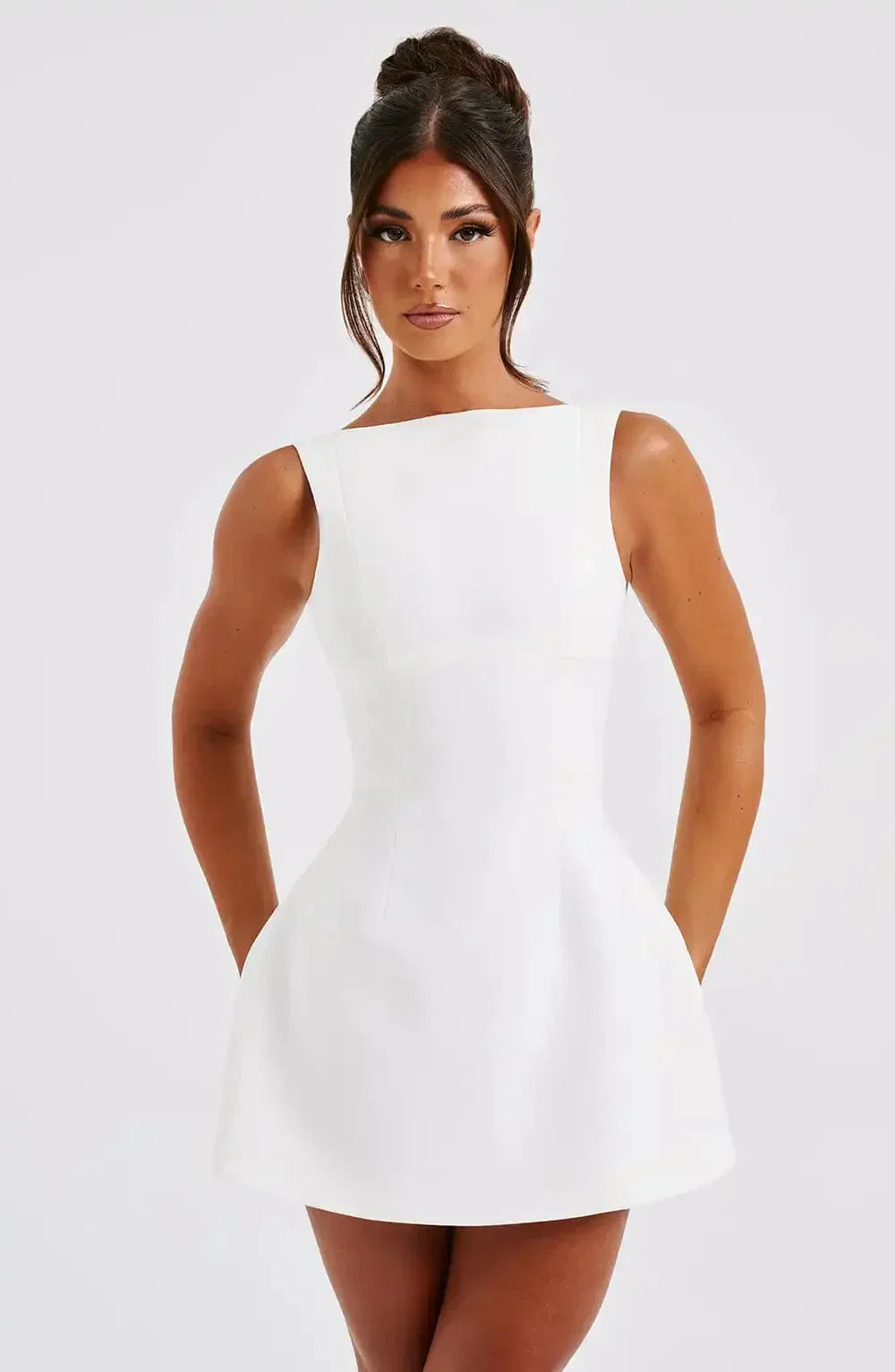 Chic women's structured mini dress featuring a flattering fit & flare silhouette and boat neckline.