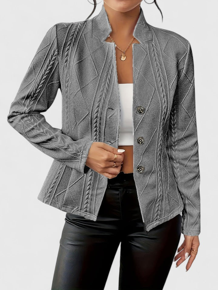 Chic women's tailored jacket with a stand collar, versatile for fashion or professional attire.