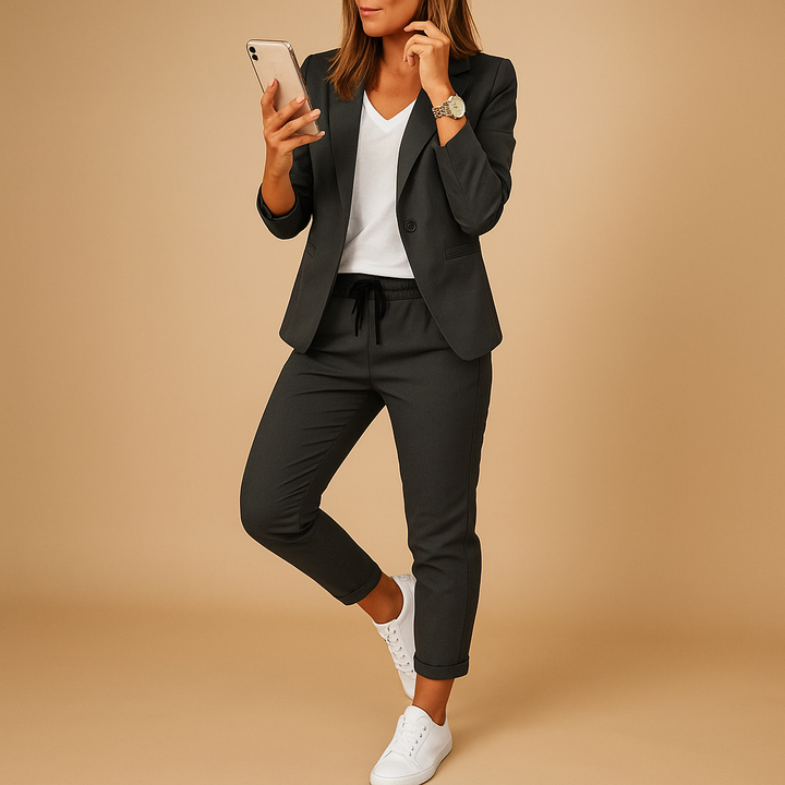High-quality tailored women's suit with a sharp blazer and trousers, creating a polished professional business attire.