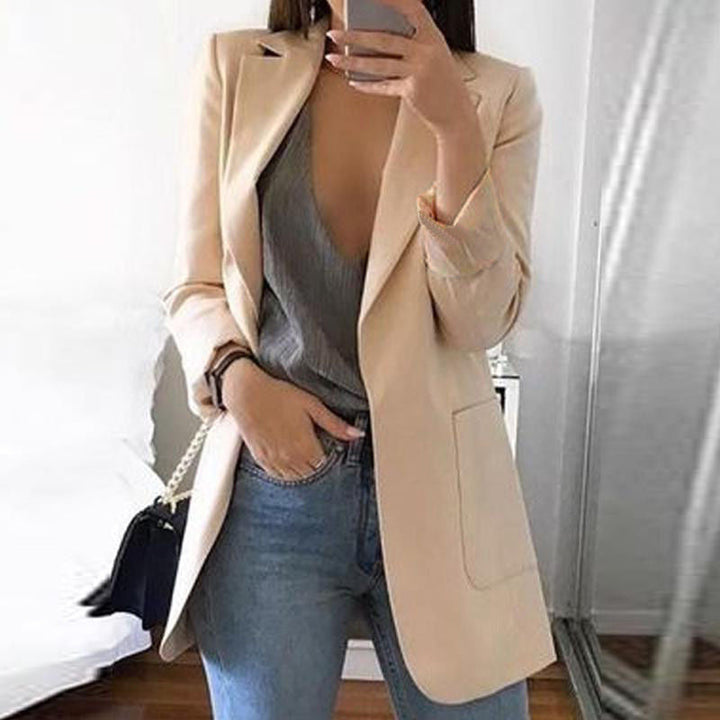 Women's professional tailored blazer, an elegant long sleeve jacket for chic office wear and business attire.