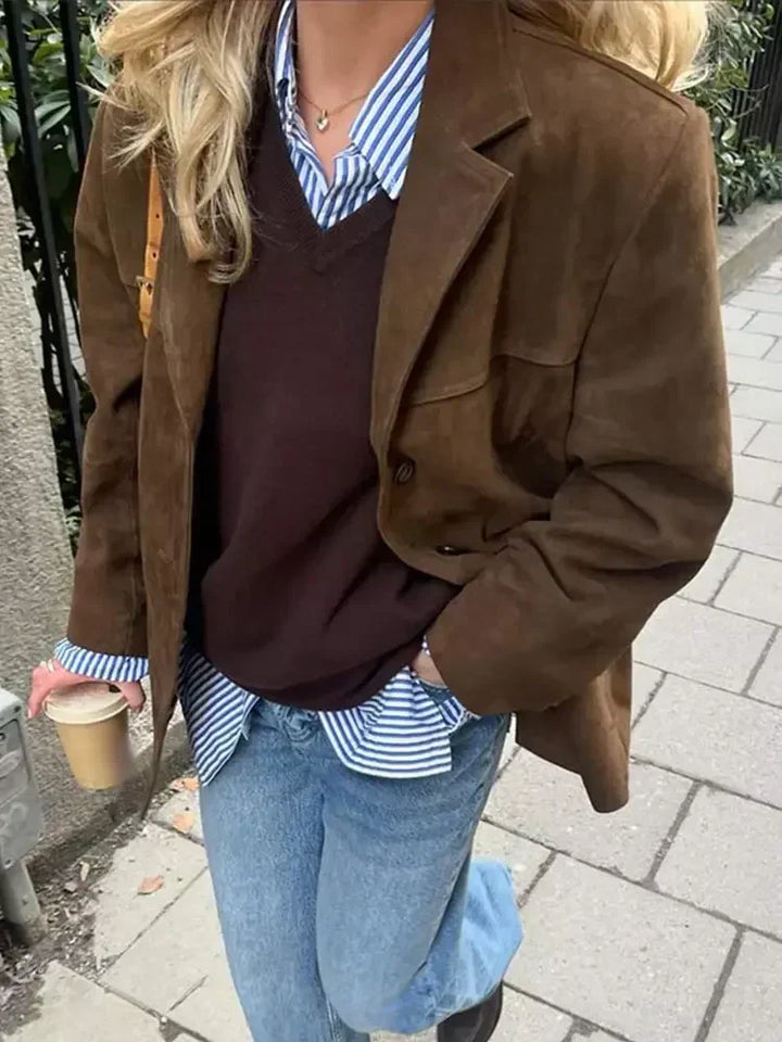 Warm ladies' autumn jacket with a tailored fit. Stylish fall fashion coat for an elegant silhouette.