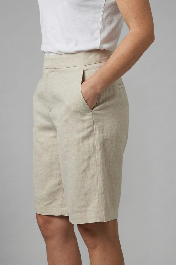 Women's elegant tailored knee-length shorts, flat front, perfect for sophisticated summer fashion.