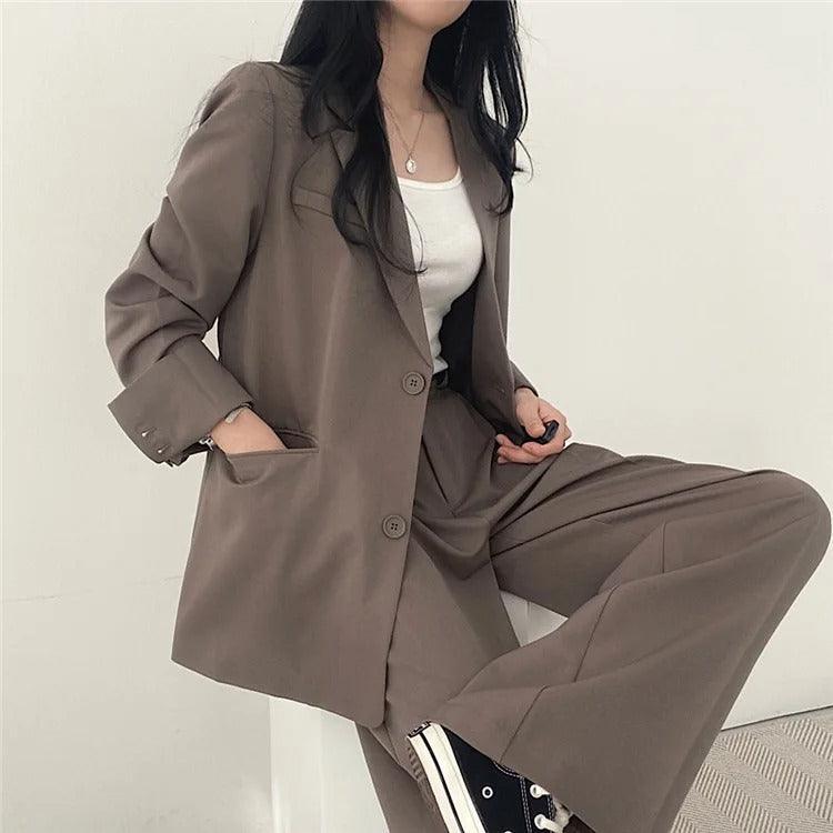 Women's formal business suit, complete with a long tailored blazer and classic trousers
