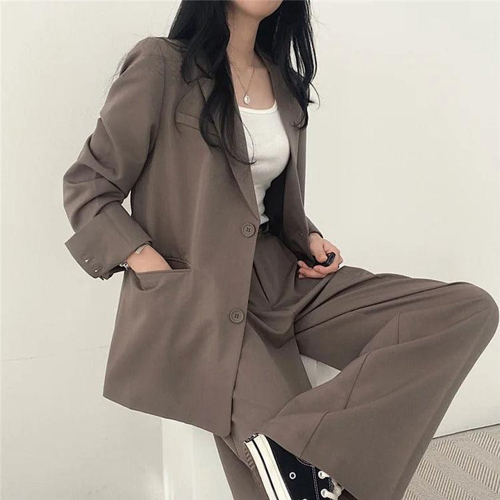 Women's formal business suit, complete with a long tailored blazer and classic trousers