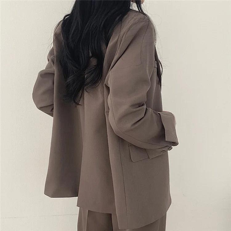 Tailored for success: women's long blazer and trousers, an elegant suit set for professionals