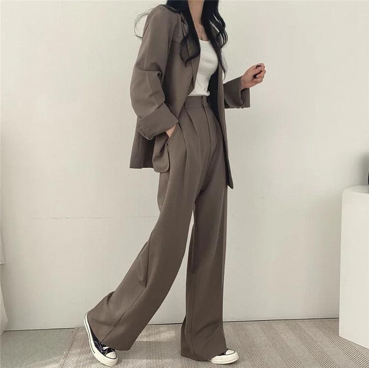 Long tailored blazer and matching trousers, an elegant women's suit for business & events