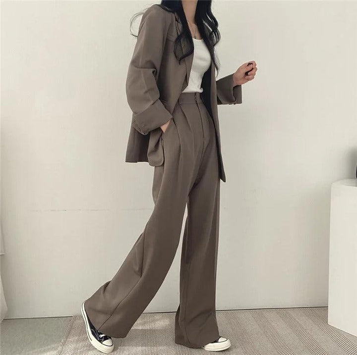 Long tailored blazer and matching trousers, an elegant women's suit for business & events