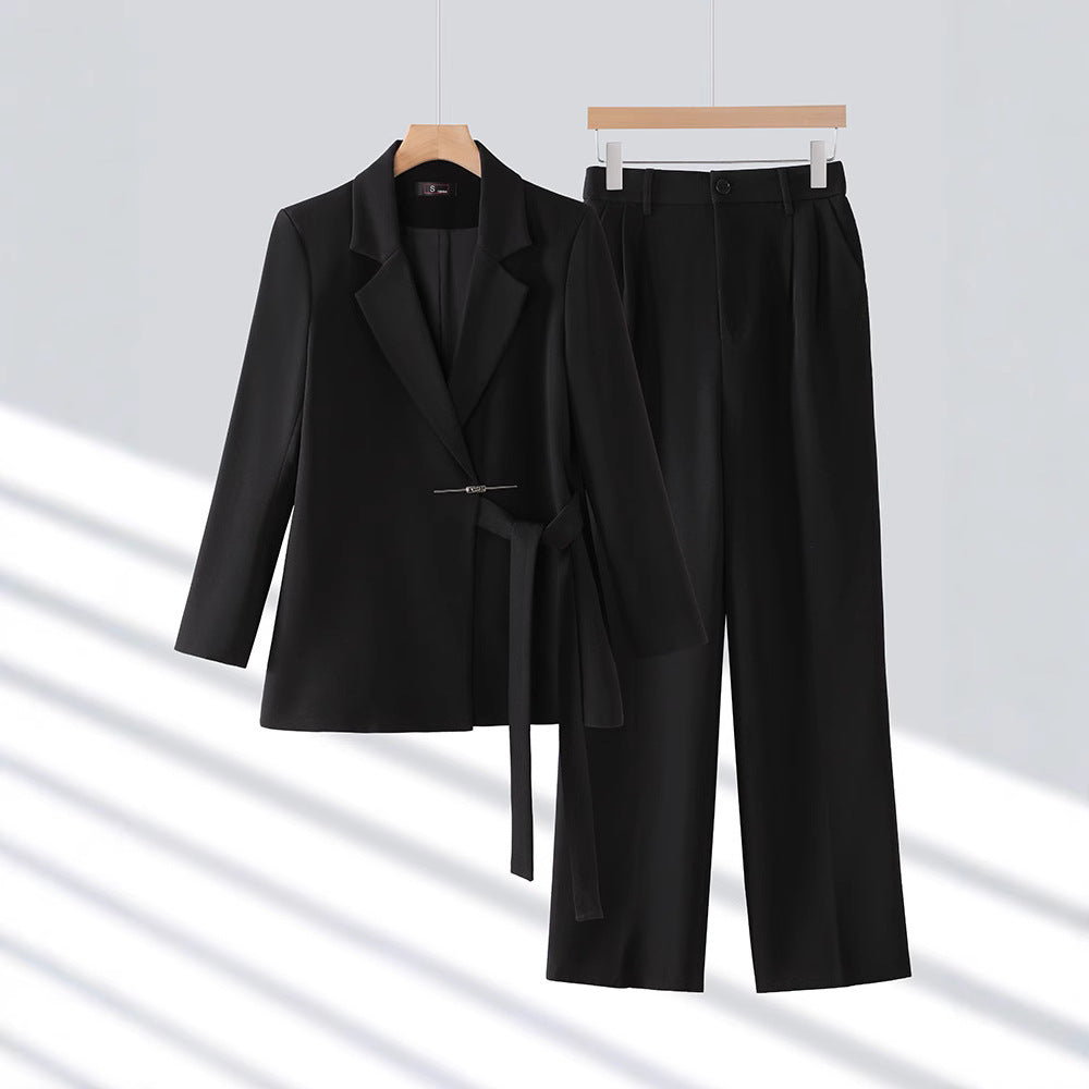 Sophisticated two-piece women's tailored blazer and trouser set, a professional and elegant business attire.