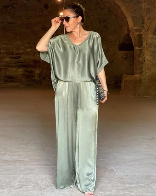 Elegant women's tailored two-piece top & pants set for office wear. Chic coordinated spring fashion.