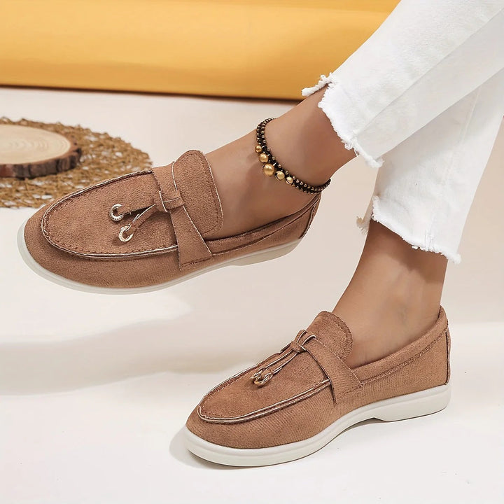 Elegant women's tassel loafers, perfect slip-on flats for everyday chic and comfort.