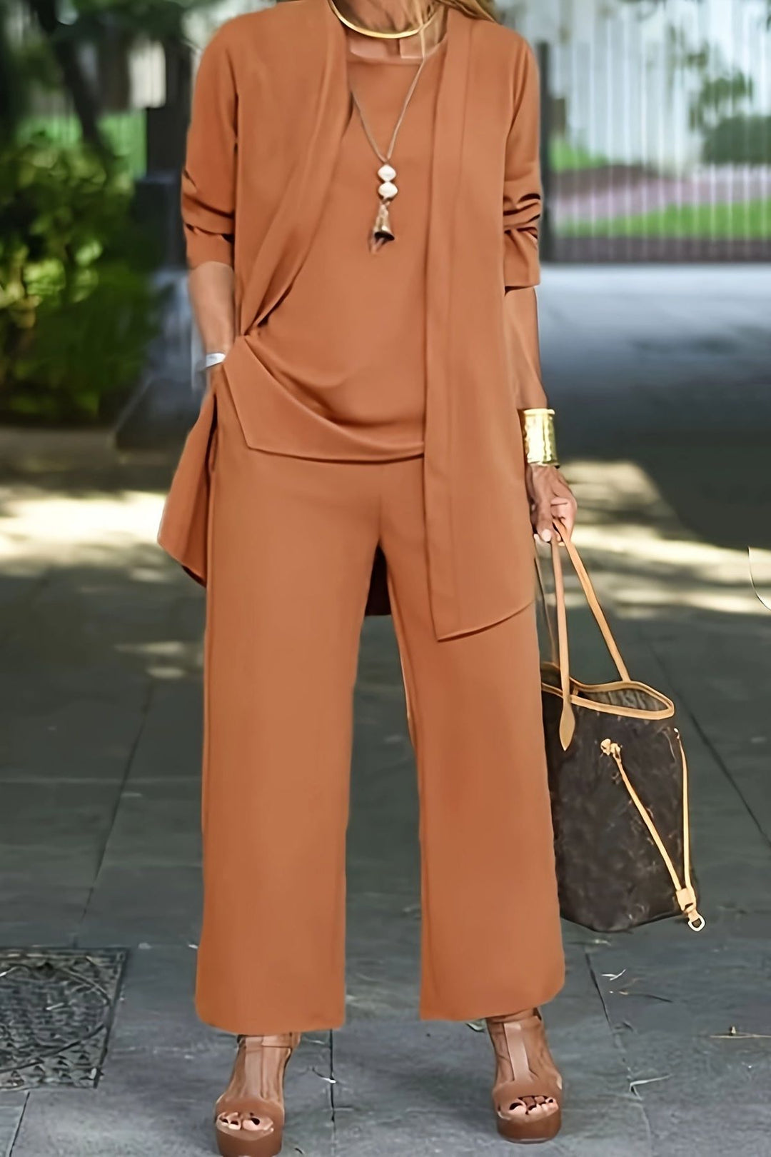 Elegant women's three-piece coordinated set with wide-leg pants & lightweight jacket. Perfect for work or casual.