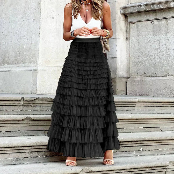 Chic women's tiered maxi skirt featuring elegant ruffles, perfect for formal evening events.