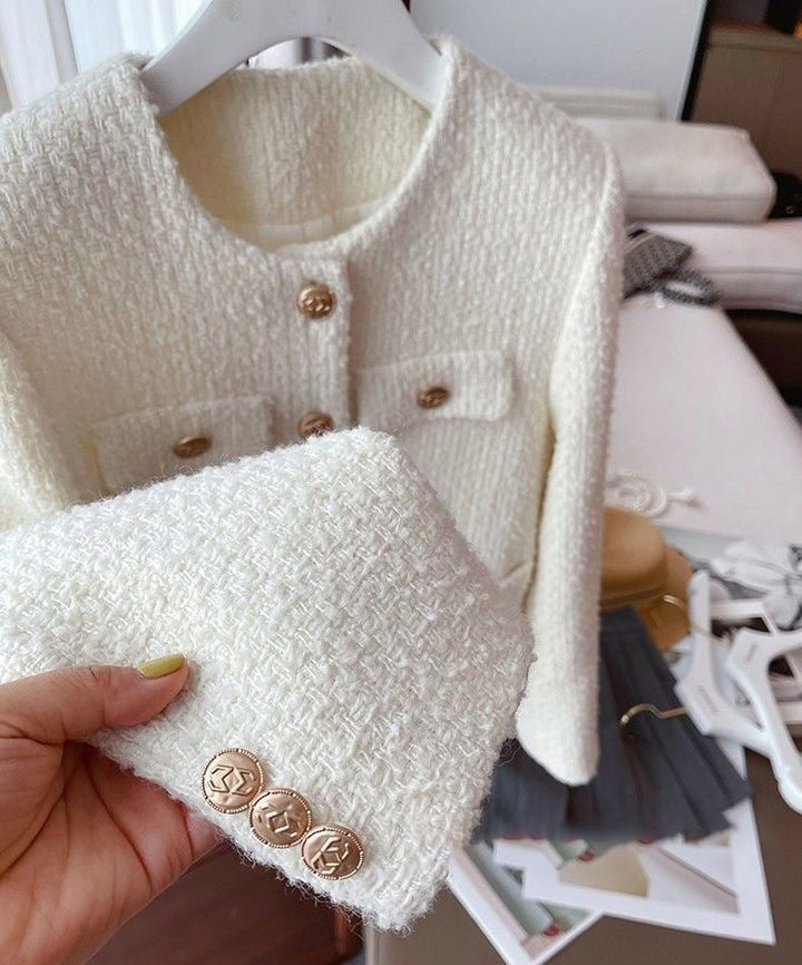 Classic tweed jacket for women with a round neck, embodying casual chic and versatile ladies' fashion.