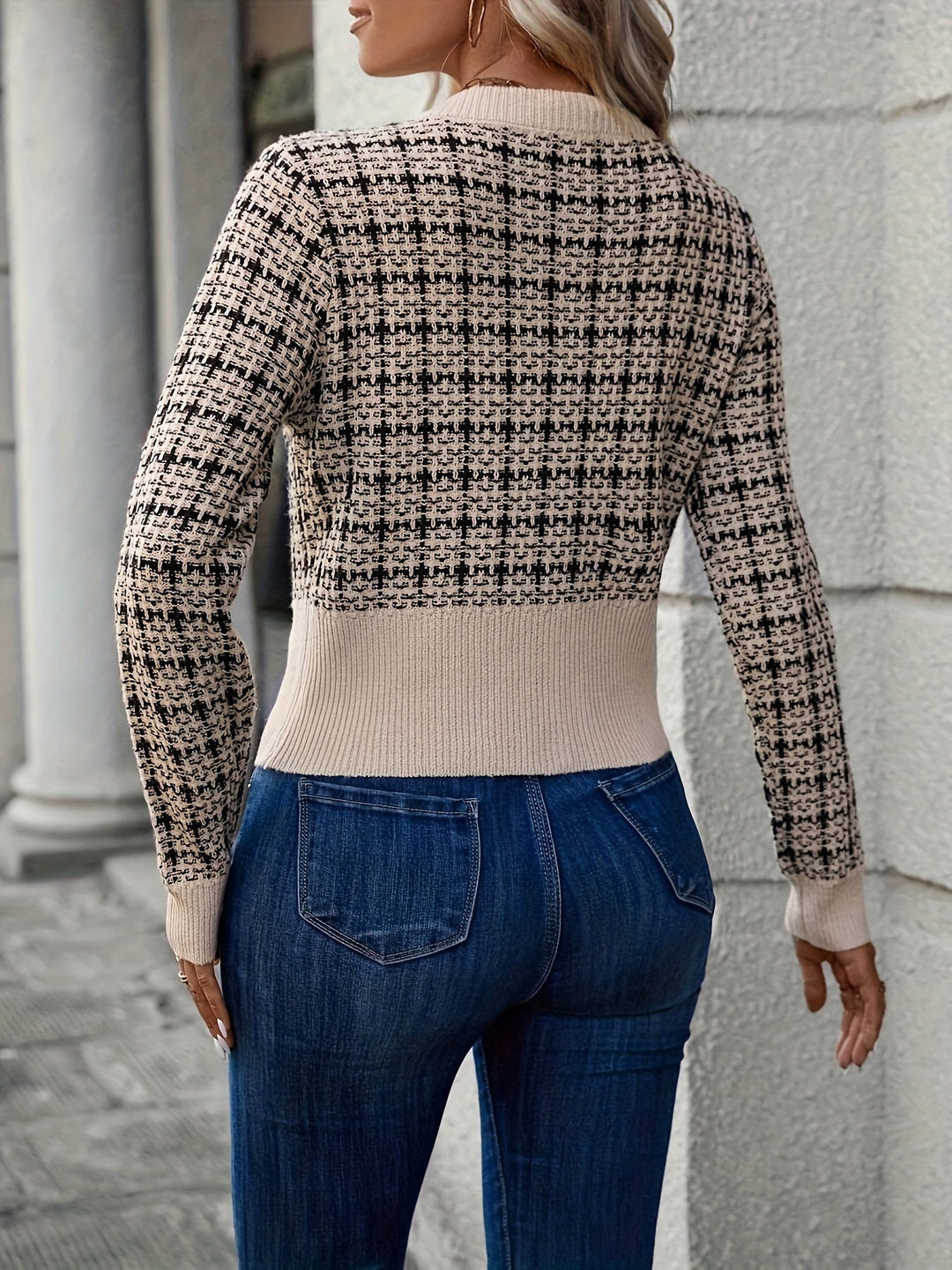 Stylish women's tweed knit cardigan featuring a button-front design, ideal for adding elegance to any ensemble.