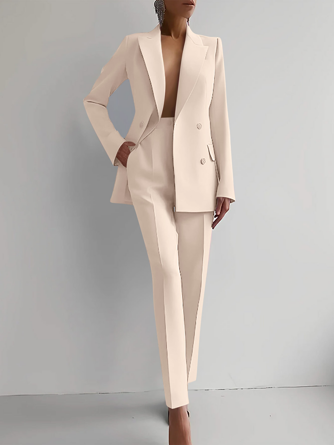 Modern women's professional two-piece suit, featuring an elegant tailored blazer and stylish pants.