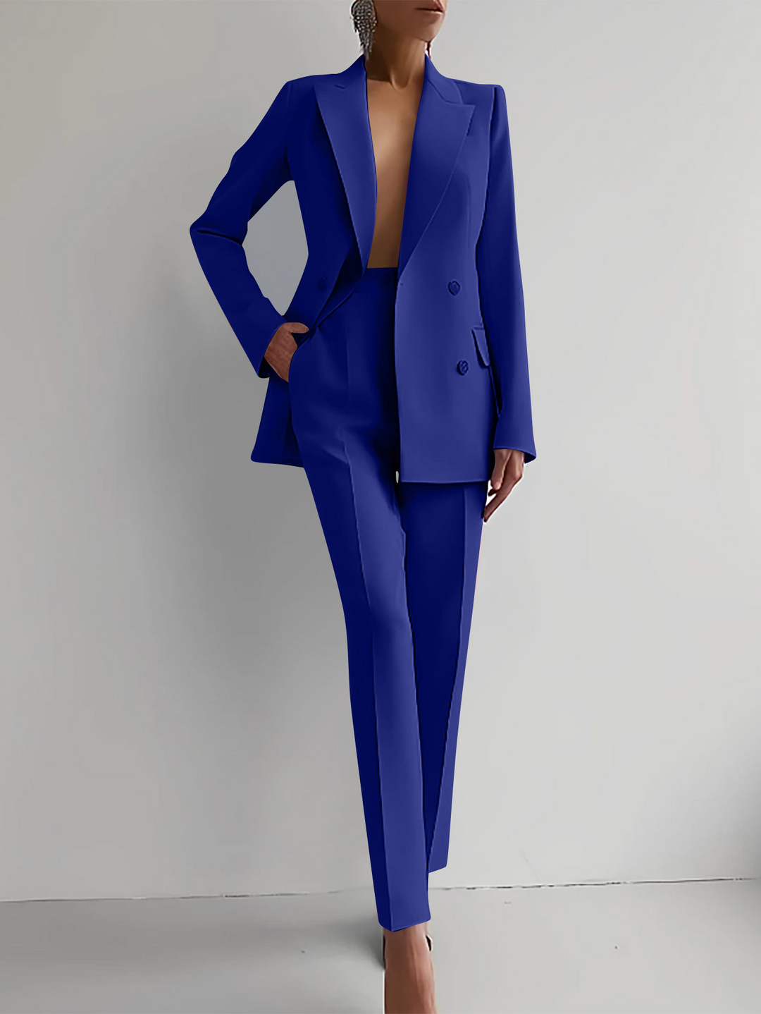 Elegant women's two-piece blazer set with modern tailored jacket & matching pants for formal or office attire.