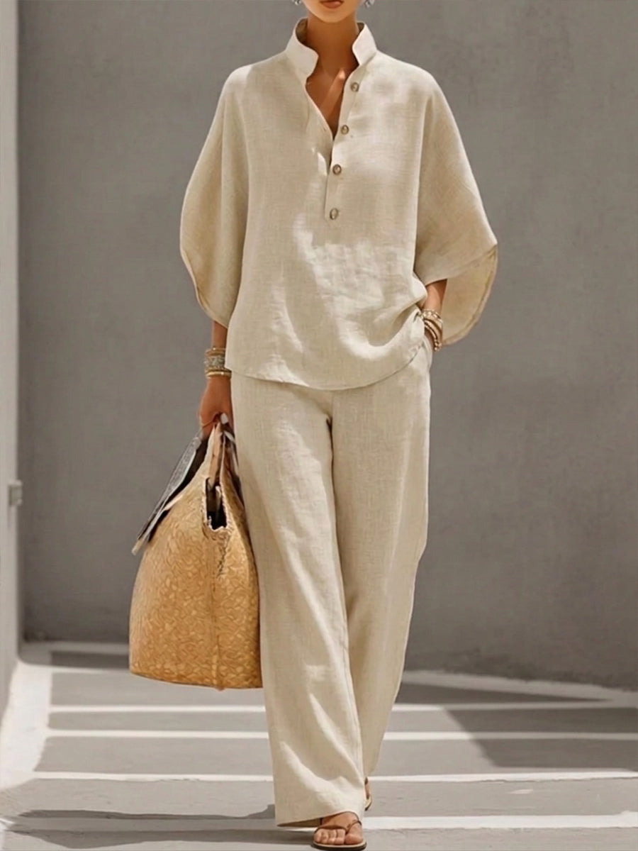 Elegant women's two-piece set: a comfortable batwing blouse with wide-leg trousers, perfect for casual or loungewear.