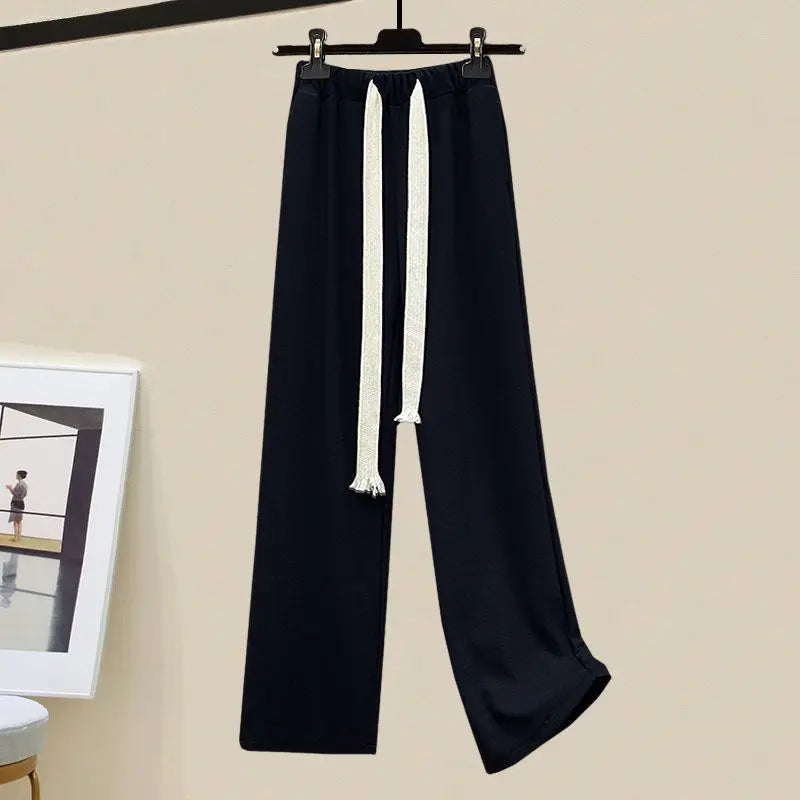 Cozy & elegant women's two-piece set: long-sleeve sweater and wide-leg trousers. Ideal for stylish everyday comfort.