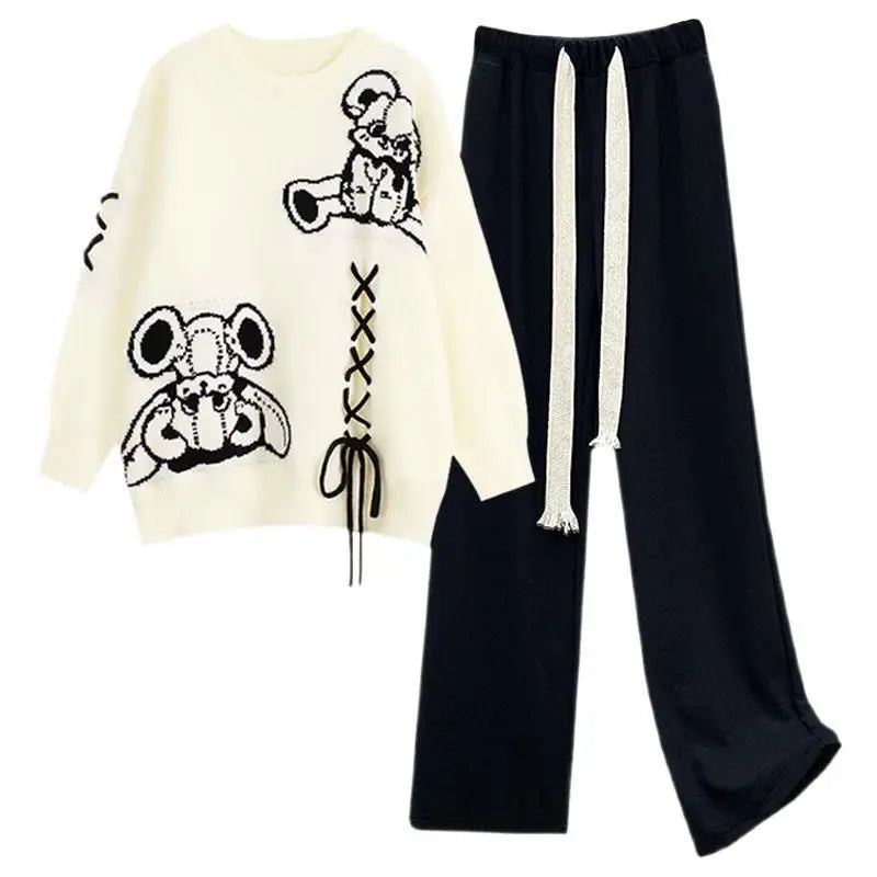Stylish women's knit sweater and wide-leg pant set. This chic two-piece ensemble is perfect for cozy elegant fashion.