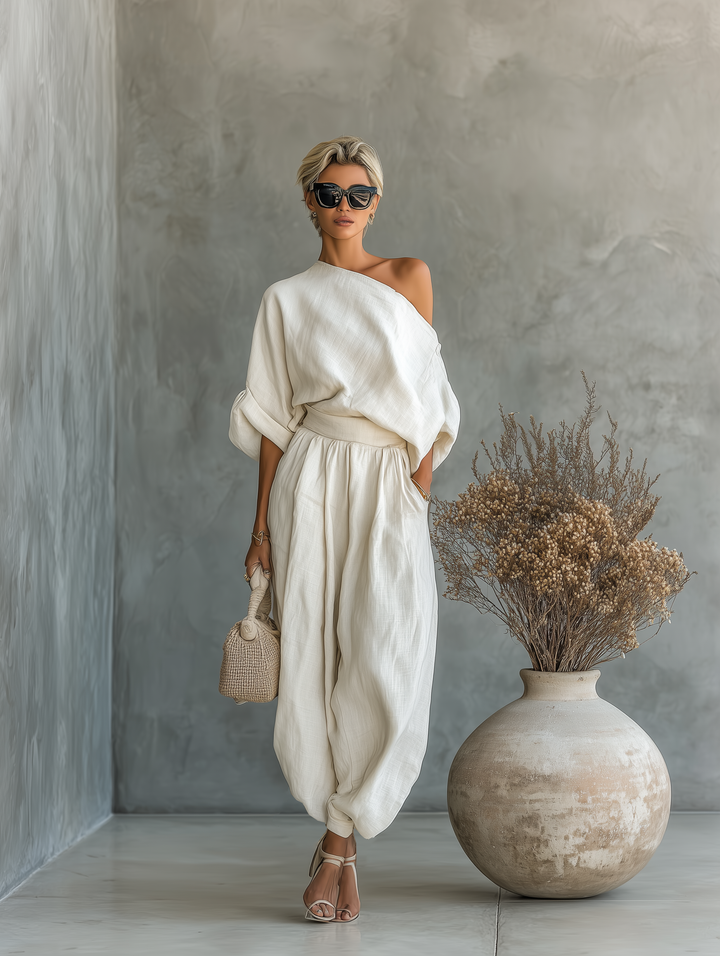 Stylish women's asymmetric drape top & comfortable elastic waist wide leg pant set, ideal for casual chic.