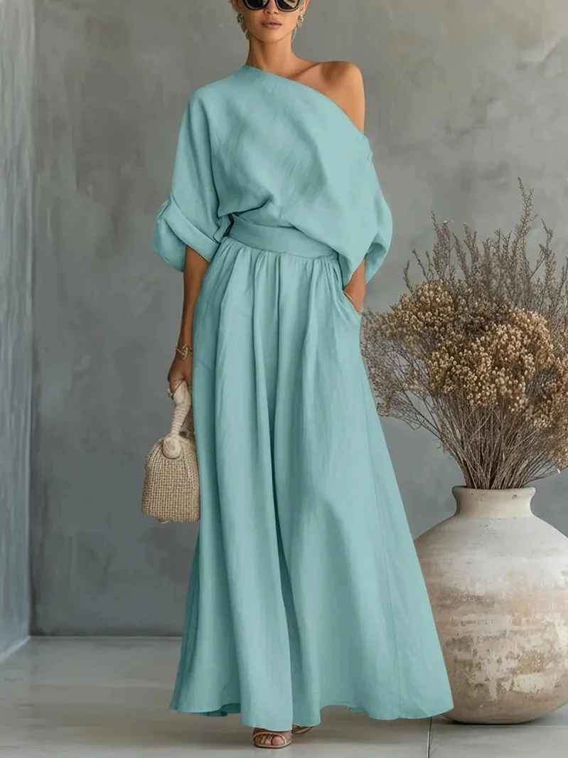 Sophisticated women's coordinated set: asymmetric drape top & elastic waist wide leg pants for a stylish, relaxed feel.